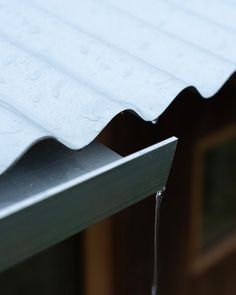 water running down the side of a roof