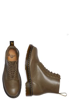 Show off signature style in this monochromatic leather combat boot constructed with an AirWair-cushioned footbed and iconic lugged sole. 1/2" heel; 1" platform Leather upper and lining/synthetic sole Imported Fall Combat Boots With Vibram Sole For Streetwear, Fall Streetwear Boots With Cushioned Footbed, Fall Streetwear Lace-up Boots With Leather Footbed, Leather Footbed Combat Boots With Round Toe For Streetwear, Leather Footbed Combat Boots For Fall Streetwear, Leather Footbed Combat Boots For Streetwear, Fall Streetwear Steel Toe Combat Boots, Casual Combat Boots With Vibram Sole For Fall, Casual Combat Boots With Reinforced Toe For Streetwear