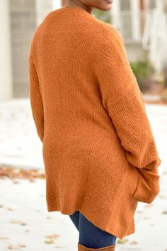 Add this rust colored cardigan to any ensemble for a nice cozy feeling. Two Pockets Model is wearing a Small Brown V-neck Cardigan For Layering, Brown Knitted Cardigan For Fall, Brown Knit V-neck Outerwear, Brown Textured Knit Cardigan For Layering, Brown V-neck Knitted Cardigan, Cozy Brown Long Sleeve Cardigan, Brown Textured Knit Cardigan, Fall Cardigan For Loungewear, Cozy Brown Knit Sweater Coat