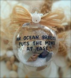 an ocean breeze puts the mind at ease ornament with seashells in it