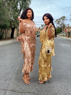 Off shoulder sequins fringe dress Has no stretch Zipper back closure Short model is wearing a size small Tall model is wearing a size medium Small US 2-4 Med US 6-8 Large US 10-12 XL US 14 1970s Disco Fashion, 1970s Fashion Disco, Gold Fringe Dress, Gold Satin Dress, 1970s Disco, Dress With Fringe, Disco Fashion, Gold Fringe, Short Models