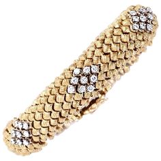 This artfully designed and meticulously crafted 1960s flexible link vintage bracelet is rendered in solid 18K gold. This exquisite Vinatge bracelet is embellished with 6 set diamond-shape diamond decors, each composed of 9 round-faceted diamonds, collectively weighing 3.50cts, graded G-H color and VS1 clarity. The bracelet features az skin-friendly undercarriage and secures with a well-concealed double tongue-in-groove, a figure-eight safety lock and chain. This aesthetically captivating bracele Bulgari Bracelet, Flexible Bracelet, Retro Bracelet, Diamond Decorations, Diamond Weave, Diamond Bangles Bracelet, Vintage Bracelet, Diamond Bangle, Bracelet Crafts