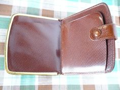 "Vintage 80s Brown Leather Wallet, Spanish Leather Wallet, Diamond Embossed Snap Closure Wallet with Gold Metal Frame, 4 x 3.75\", Coin Purse DESCRIPTION: ➵ Brown leather ➵ Fine diamond pattern and texture ➵ 1 snap button closure ➵ Small flap pocket on the inside ➵ Slight wear and a little colour is off on the snap button (pictured). MEASUREMENTS: 4\" (10.1 cm) x 3.75\" (9 cm) LABEL: Made in Spain. FABRIC: Leather. WEIGHT: 95 g. CONDITION: Very good. This item is sold AS IS, and the price reflec Retro Bifold Wallets With Coin Pocket, Vintage Rectangular Card Holder With Coin Pocket, Vintage Card Holder With Interior Slots, Vintage Bifold Card Holder With Interior Slots, Retro Rectangular Wallet With Coin Pocket, Vintage Brown Rectangular Card Holder, Vintage Compact Coin Purse With Card Slots, Vintage Compact Wallets For Evening, Vintage Compact Evening Wallet