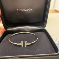 Perfect Condition! New Style Still In Stores Comes With Original Tiffany Box Authentic! Tiffany T Wire Bracelet With Diamonds Fits A Small Wrist, Stretches Size Small White Gold With Diamonds! Bought Before Price Increase, So Price Is Low! Tiffany T Wire Bracelet, Elegant Tan Jewelry For Formal Occasions, Elegant Tan Bracelet For Gift, Tiffany T Wire, Wrist Stretches, Bracelet With Diamonds, Tiffany Box, Jewelry Tiffany, Tiffany T