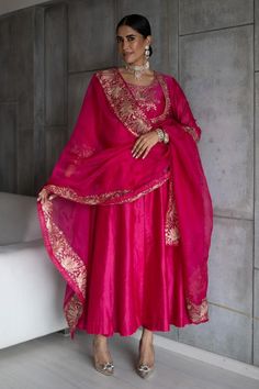 Hot pink silk chanderi anarkali with zari and gota hand embroidery. Comes with straight pant, an organza dupatta and a potli.
Components: 4
Pattern: Embroidered
Type Of Work: Zari, Gota
Neckline: Round
Sleeve Type: Full
Fabric: Silk chanderi, Dupatta: Organza
Color: Pink
Other Details: 
Note: Jewellery worn by the model is not for sale.
Occasion: Sangeet - Aza Fashions Silk Suit Designs Indian, Pink Indian Suit, Pink Suits Women, Silk Anarkali Suits, Anarkali Dress Pattern, Pink City, Indian Dresses Traditional, Pant Set For Women, Boutique Dress Designs