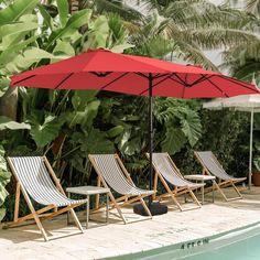 lounge chairs and an umbrella next to a swimming pool