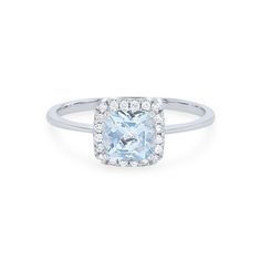 a cushion cut aqua blue topazte and diamond ring in 18k white gold