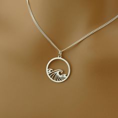 Ocean Waves Necklace - Sterling Silver Circular Pendant - 18ct Gold & Rose Gold Options Embrace the calming beauty of the sea with our Handmade Ocean Waves Necklace, featuring a detailed Sterling Silver Circular Ocean Wave Pendant. This elegant piece is perfect for those who find peace and inspiration in the rhythm of the waves. WHY YOU'LL LOVE THIS NECKLACE: * Nature-Inspired Design - The ocean wave represents calm, strength, and the endless flow of nature, making it a meaningful accessory. * H Blue Round Pendant Jewelry, Waves Necklace, Wave Pendant, Wave Necklace, Rose Gold Pendant, Find Peace, Ocean Wave, Nature Inspired Design, Ocean Inspiration