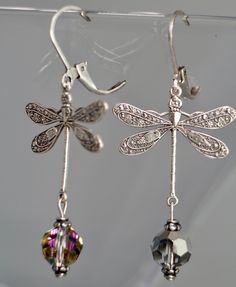 Victorian Style Dragonfly Earrings with 8mm Vitrail Czech glass beads. Vitrail is French, meaning stained glass window. They are pretty beads with greens and purples. The earrings are 2 inches long. The Dragonflies are a Sterling Silver Plated Brass. All purchases come in a gift box. Elegant Dragonfly Earrings With Ear Wire, Elegant Hypoallergenic Dragonfly Earrings, Woodland Earrings, Victorian Earrings, Boho Jewellery, Earrings Art, Pretty Beads, Dragonfly Earrings, Art Nouveau Style