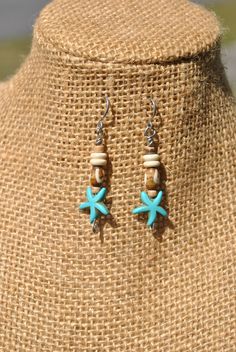 Just in time for summer, you can pick up these little beach theme earrings! I used turquoise color howlite starfish beads, bone beads and small wood beads to create the design. The eye pins and ear wires are stainless steel, making them easy to wear and care for. Need a gift idea for some one who loves the beach and tropical settings or want to add something new to your own accessory collection? Then check out these unique handmade earrings! Length from top of ear wire - appx 2.05 inches Thank you for shopping with small business! If you love these handmade starfish earrings, then check out our other creations from our home page: www.etsy.com/shops/Rocks2Gems2Wire or have something custom made just for you! PLEASE read our policy and jewelry care information below before ordering and Thank Starfish-shaped Beaded Beach Jewelry, Beach Wire Wrapped Drop Earrings, Handmade Coastal Jewelry For Summer, Adjustable Starfish Charm Jewelry, Ocean-inspired Jewelry With Lobster Clasp For Vacation, Ocean-inspired Jewelry For Vacation With Lobster Clasp, Bohemian Ear Wire Jewelry For Beach, Bohemian Ear Wire Jewelry For The Beach, Adjustable Drop Earrings For Vacation