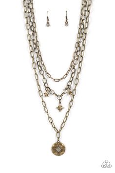 Three gritty brass chains layer down the chest. Flanked by a pair of hammered brass stars, a white rhinestone dotted star swings from the centermost chain above a hammered brass frame twinkling with a white rhinestone dotted star design for a stellar finish. Features an adjustable clasp closure.

 Sold as one individual necklace. Includes one pair of matching earrings. Nickel-free Dangle Brass Necklace, Paparazzi Brass Chain With Brass And Silver Hammered Coins Necklace, Silver Steampunk Brass Necklaces, Bohemian Multi-strand Brass Necklaces, Steampunk Silver Brass Necklaces, Hammered Brass, Brass Bracelet, The Northern Lights, Brass Necklace