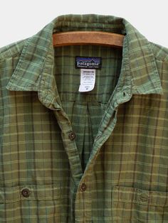 A lightweight organic cotton button down shirt by Patagonia. ✨ Patagonia says this is a Men's size Medium, but we say gender sizing is out. Fit is slightly oversized, boxy. Cotton Button-up Camp Shirt For Outdoor, Green Cotton Outdoor Shirt, Green Cotton Shirt For Outdoor, Patagonia Long Sleeve Cotton Tops, Green Relaxed Fit Cotton Flannel Shirt, Green Cotton Flannel Shirt With Relaxed Fit, Cotton Camp Shirt With Relaxed Fit For Outdoor, Relaxed Fit Cotton Camp Shirt For Outdoor, Relaxed Fit Cotton Flannel Shirt For Outdoor