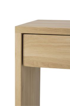 a close up of a wooden table with a drawer on the bottom and one drawer at the top