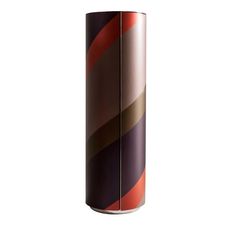 a tall vase with different colored stripes on the outside and inside, sitting in front of a white background