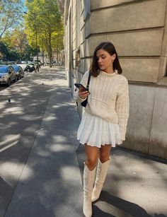 City Outfit Summer Street Style, Layering Short Dress, Cream Boots Outfit Summer, Hair For Turtleneck Dress, Cream Tall Boots Outfit, Beige Stiefel Outfit, Cowboots Outfits, Cream Mini Skirt Outfit, Ivory Boots Outfit