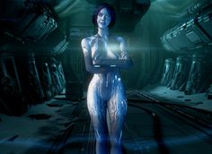 a woman standing in a sci - fi environment holding a tablet