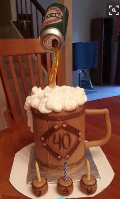 a birthday cake made to look like an old barrel with beer and ice cream on top