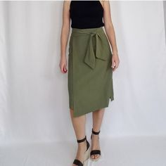 Olive Green Faux Wrap High Waist Midi Skirt Size Small Side Zipper Closure With Waist Tie. 80% Rayon, 20% Polyester All Measurements Are Approximate 14" Waist, 19.75" Hips, 26" Length Summer Workwear Knee-length Skirt, Versatile Summer Midi Skirt, Spring Versatile Pencil Skirt, Versatile Spring Pencil Skirt, Chic Lined Mini Skirt For Brunch, Versatile Midi Length Skirt For Day Out, Elegant Fall Pencil Skirt For Day Out, Versatile Lined Spring Skirt, Versatile Spring Lined Skirt