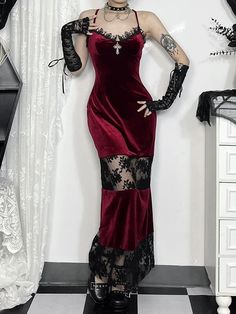 This stunning dress features intricate lace trim, a see-through lace patchwork design, and a striking cross pendant for added edge. Made with a comfortable blend of polyester and spandex, this dress is as versatile as it is chic. Available in a bold red color and a range of sizes, including S, M, and L, this dress is s Halloween Sleeveless Dress With Lace Trim, Costume Party Dresses With Lace Trim, Lace Dresses With Lace Trim For Costume Party, Gothic Lace Patchwork Dress, Gothic Red Dress With Lace Trim, Gothic Lace Dress For Halloween, Halloween Night Out Dress With Lace Trim, Gothic Dresses With Lace Patchwork, Gothic Style Dress With Lace Patchwork