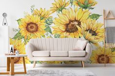 a living room with sunflowers painted on the wall