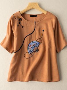 Casual Embroidered V-neck Top For Fall, Casual V-neck Embroidered Top With Multicolor Embroidery, Casual V-neck Top With Multicolor Embroidery, Casual V-neck Blouse With Geometric Embroidery, Non-stretch Graphic Print Tops For Spring, Casual Embroidered Short Sleeve Top For Spring, Summer Crew Neck Blouse With Floral Embroidery, Crew Neck Blouse With Floral Embroidery, V-neck Top With Geometric Embroidery For Fall