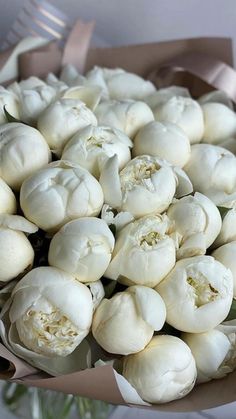 a bunch of white flowers in a vase