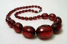 1920s ART DECO OVAL FACETED CHERRY AMBER BAKELITE BEAD NECKLACE 56 grams | eBay Vintage Round Bead Necklaces Collectible, Vintage Faceted Round Bead Necklace, Vintage Faceted Round Bead Necklaces, Vintage Round Faceted Jewelry, Vintage Faceted Necklaces As Gifts, Vintage Faceted Necklace For Gift, Bakelite Necklace, Faceted Bead Necklace, Vintage Cherry