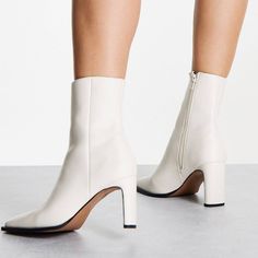 Off White Square Toe Ankle Boots. Would Look Amazing With A Turtleneck Sweater Dress And Pea Coat Or A “Shades Of White/Neutral” Outfit. Depending On How You Style It Can Go Rich Housewife/Mod/Corporate Baddie/Quiet Luxury. Never Worn But I Did Notice A Small Scuff On The Heel So Wanted To Point It Out To You (Yellow Arrow). Note: This Boot Has A Fairly Narrow Shaft So Not Big Calf Friendly. It Is Pretty Snug On Me But I Didn’t Return It Bc I Still Thought It Was Cute . Size 11 | 3.5” Heel Fitted White Faux Leather Boots, White Block Heel Boots For Winter, White Ankle-high Heeled Boots For Winter, White Faux Leather Heeled Boots For Winter, White High Ankle Faux Leather Heels, White Faux Leather High Ankle Heels, Fitted White Synthetic Heeled Boots, Elegant White Faux Leather Heeled Boots, Elegant White Faux Leather Boots