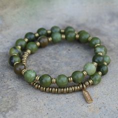 Jade Mala Bracelet. Genuine green jade bracelet for good luck. Made with genuine jade gemstones. Brass hand made beads support women in Africa. Contains 27 beads so its a wrist mala! Stringed on our signature and exclusive thick hitec elastic. Made in the USA. Jade is said to bring harmony to the wearer and to attract prosperity and abundance. Jade Mala, Green Jade Bracelet, Women In Africa, Prosperity And Abundance, Aromatherapy Bracelet, Wrist Mala, Brass Hand, Support Women, For Good Luck