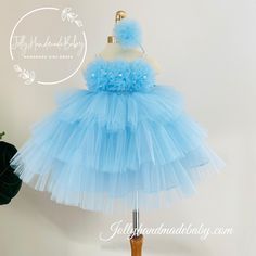 ♥ Introducing the exquisite Blue Tutu Dress, a stunning creation by Jolly Team that embodies elegance and charm. This enchanting dress features a delicate blue tulle fabric adorned with a beautifully rose accent, making it the perfect choice for special occasions or playful outings. The design showcases a cool shoulder style complemented by a pearl tide detail, ensuring a sophisticated yet whimsical look.  ♥ Crafted from high-quality materials, this dress promises both comfort and durability, al Light Blue Princess Style Wedding Dress, Elegant Light Blue Gown For Dress-up, Spring Princess Style Blue Ball Gown, Whimsical Blue Dress For Dress-up, Blue Princess Gown For Party, Elegant Blue Princess Dress For Dress-up, Princess Style Blue Gown For Party, Blue Princess Style Party Gown, Blue Princess Fairy Dress For Party