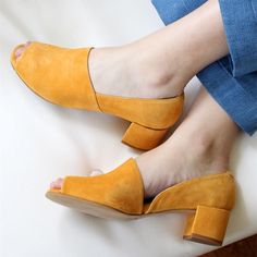 Step back in time with these vintage mustard vegan suede pumps. Featuring a peep-toe and cut-out design, with a comfortable block heel. Elegant, comfortable, and cruelty-free, perfect for any occasion. Color: Mustard Material: Vegan suede Heel Type: Block heel Heel height: 2" / 50 mm approx Product measurements were taken using size 8. Please note that measurements may vary by size. Toe: Peep toe Cut-out design Handcrafted US sizing. Fits true to size. Vintage Style Shoes, Block Heel Pumps, Peep Toe Shoes, Yellow Shoes, Block Heel Shoes, Suede Block Heels, Prom Shoes, Comfortable Heels, Heel Pumps