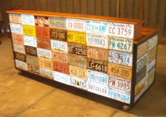 an old dresser with license plates on it