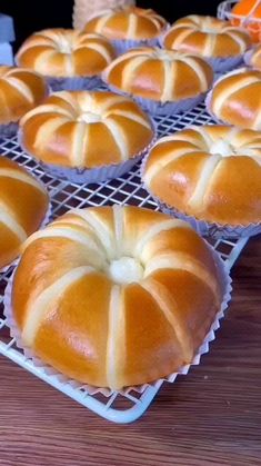 several loaves of bread sitting on cooling racks