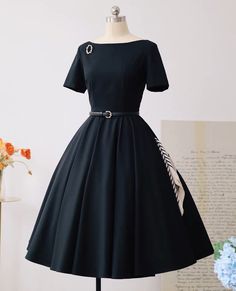 Beautiful vintage style dress. Comes with broach, gloves, and belt made with same material as the dress. Material: Dress - 88% Nylon, 12% spandex. Lining - 96% Polyester, 4% spandex. Sizes: Xsmall - bust 80cm, waist 62cm, length 102cm  Small - bust 84cm, waist 66cm , length 103cm Medium - bust 88cm, waist 70cm, length 103cm  Large - bust 92cm, waist 74cm, length 104cm  Xlarge -bust 96cm, waist 78cm, length 105cm  Hello and welcome to my shop! I am new to Etsy but not to this business. All our dresses are handmade with high quality fabrics by skilled tailors. Rest assured, the dress you see in the picture is the dress that you will receive. Our dresses are priced very competitively to bring you the best value. About Size All sizes listed are external sizes of the clothing, not what your bod Classic Black A-line Vintage Dress, Black A-line Vintage Dress, 1950s Style Black Knee-length Dress, Retro Black Vintage Dress For Evening, Elegant Black Dress For Vintage Events, Fitted Black Dress For Vintage Events, Black Fitted Dress For Vintage Events, Black 1950s Style Wedding Dress, Vintage Belted Formal Dress