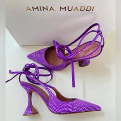 These Purple Amina Muaddi Karma 95 Crystal Suede Pumps Feature A Pointed Toe, Sculpted 95 Mm Heel, All-Over Embellishments, Branded Leather Insole And Slingback Strap With Ankle Tie Detailing. If Our Actions Determine Our Future Fate, We're On Our Best Behaviour. We're After Some Good Karma By Way Of These Amina Muaddi Pumps, Please. This Piece Fits True To Size. We Recommend You Select Your Regular Size. Luxury Purple Heels, Mach Mach Shoes Purple, Amina Muaddi Purple Heels, Lace Up Sandal Heels, Shoe Goals, Amina Muaddi Heels, Purple High Heels, Wedding Shoes High Heels, Sparkly Pumps