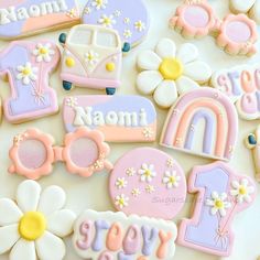 decorated cookies are arranged on a table with the words mom and baby spelled in them