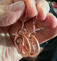 Hand Hammered Pure Copper Dangley earrings With Hand Hammer Copper earwires to match. Just Beautiful We generally use these for gifting to others. Each pair is unique but similar in size. These can be customized if you want a longer length either rochelle each pair is unique but similar in size. These can be customized if you want a longer length either with dentalium shell in green or white or additional copper dangles, please message me for quote. Tots-May-Way, Tonya Hoches Handmade Copper Wrap Earrings For Gift, Handmade Rose Gold Wrap Earrings, Handmade Rose Gold Wrap Earrings Gift, Copper Dangle Hoop Earrings Gift, Hammered Copper Hoop Earrings As Gift, Copper Hammered Hoop Earrings As Gift, Unique Hypoallergenic Copper Earrings, Unique Rose Gold Earrings With Ear Wire, Rose Gold Hammered Dangle Earrings