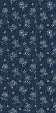 a blue background with white flowers and leaves on the bottom half of it, as well as dark blue fabric