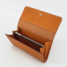 Tom Taylor handmade ladies wallet/clutch. Crafted with the finest vegetable tanned leather. Beautiful London tan color, six cards slots, zippered change purse, removable clutch strap, deep pocket holds cellphone or checkbook. Ladies Wallets Purses, Leather Wallet Women's, Leather Clutch Pattern, Best Slim Wallet, Handmade Leather Bag Pattern, Leather Handbag Patterns, Tom Taylor, Ladies Wallet, Leather Bag Pattern