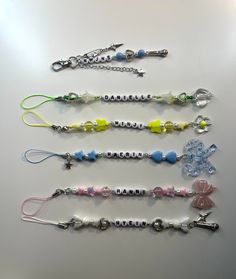 five different types of lanyards are lined up on a table