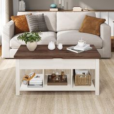 a living room with a white couch and coffee table