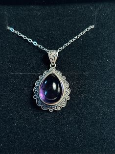 Beautiful Smooth Amethyst Teardrop Set In A 925 Silver Pendant This stunning pendant & chain is supplied Gift Boxed. Pendant measures 19.4mm Wide x 32mm including the bail. Lovely scroll design around the amethyst You can purchase the pendant either alone or with the chain, just choose from the drop-down menu near the price. The chain length is 17.5 Inches In Length and is 925 Silver and stamped 925. The pendant is stamped 925 on the bail. Please note that silver can oxidise over time, it just n Formal Teardrop Cabochon Necklace, Teardrop Amethyst Necklace For Formal Occasions, Formal Drop Amethyst Necklaces, Formal Teardrop Amethyst Necklace, Formal Amethyst Drop Necklace, Purple Drop Necklace For Formal Occasions, Formal Drop Amethyst Necklace, Formal Purple Drop Necklace, Teardrop Cabochon Necklace For Anniversary