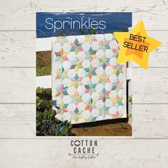 the cover of sprinkles magazine features an image of a quilt on a wooden background