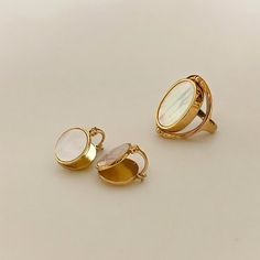 Elegant Gold Rings With Mother Of Pearl, Elegant Gold Moonstone Ring In Brass, Elegant Shell-shaped Brass Jewelry, Elegant White Abalone Shell Jewelry, Gold Mother Of Pearl Rings For Anniversary, Gold Mother Of Pearl Ring As A Gift, Gold Mother Of Pearl Anniversary Rings, Gold Shell-shaped Ring For Gift, Gold Shell-shaped Gift Ring