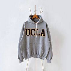 90s University of California UCLA hoodie/ XL * PLEASE READ BEFORE PURCHASE * PLEASE consider the PHOTOS before making the decision * The images may DIFFER in appearance from the actual product because we took pictures under daylight.  * PLEASE send your PHONE NUMBER after your purchase for the shipping company to contact you X No returns X No refund Condition : 9/10 More details : look at the pictures  Brand : Russell Size : XL Pit to pit/ Chests : 26/52 inches  Length : 28.5 inches  Material : Oversized Hooded Hoodie For College, 90s Style Long Sleeve Hoodie For Fall, Oversized Winter College Hoodie, Oversized Winter Hoodie For College, Oversized College Sweatshirt With Adjustable Hood, Oversized Hoodie With Ribbed Cuffs For College, Oversized Hoodie Sweatshirt For College, Vintage Hoodie For Streetwear In Fall, Vintage Hoodie For Fall Streetwear