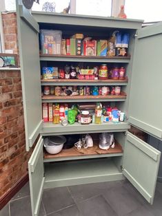 an open pantry with lots of food in it