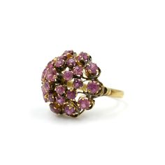 "Vintage 14kt yellow gold tiered ruby ring. The rubies are a pinkish purple color. These \"princess\" rings were popular in the 1970s. The perfect gift for July babies.  The \"14k\" mark is a bit worn but it has also been tested to guarantee purity. Stones test as ruby on the gem tester. Size 3.5 Sits .52\" off the finger  Weight: 3.57 grams Please feel free to contact me with questions and/or for additional photos. More vintage gold in the shop: 14k sapphire studs - https://etsy.me/3FmOvy8 14k ball studs - https://etsy.me/3DDdbkI *Free Domestic Shipping on Orders Over $35* All orders ship USPS First Class. If you would like to add insurance please reach out before purchase. All of our items are in good, vintage condition; because of their past lives expect some minor surface abrasions and Pink Ruby Rings With Multi-stone Detail, Pink Cluster Jewelry For Wedding, Pink Ruby Ring Stamped 14k For Wedding, Pink Ruby Wedding Ring Stamped 14k, Vintage 14k Gold Pink Jewelry, Pink 14k Stamped Wedding Jewelry, Heirloom Multi-stone Pink Rings, Pink 14k Stamped Jewelry For Wedding, Heirloom Pink Multi-stone Rings