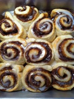 a bunch of cinnamon rolls sitting on top of each other