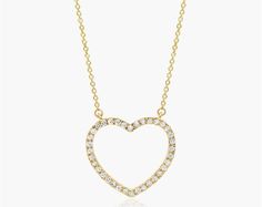 14K Yellow Gold Open Heart Diamond Necklace. Slim and sparkling, make a simple statement of love with this classic diamond heart pendant. Crafted in 14K gold, this petite style features round brilliant-cut diamonds along the facing edge. This pendant suspends along an 18.0-inch cable chain with an extra jump ring at 16 inches for versatility and secures with a lobster clasp. Heart Diamond Necklace, Petite Style, Heart Necklace Diamond, Heart Diamond, Heart Pendant Diamond, Open Heart, Petite Fashion, Diamond Heart, Round Brilliant Cut Diamond