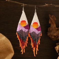 A fun vibrant beautiful beads tassel drop Earrings with sun, sunset & mountains, perfect for summer/spring. They will make any outfit pop! Pink Beaded Fringe Earrings For Beach, Beaded Drop Earrings With Tassels For The Beach, Beaded Tassel Drop Earrings For Beach, Hippie Dangle Earrings For Beach, Bohemian Beaded Earrings For Vacation, Bohemian Multicolor Earrings For Vacation, Hippie Beach Earrings For Summer, Bohemian Multicolor Vacation Earrings, Hippie Style Summer Beach Earrings